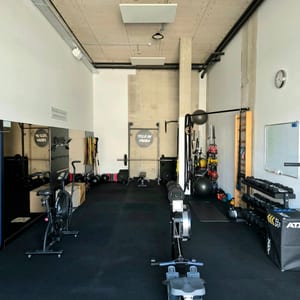 View down the studio, with rowers and a plyo box