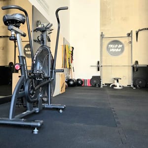 Air bike in the foreground of the studio